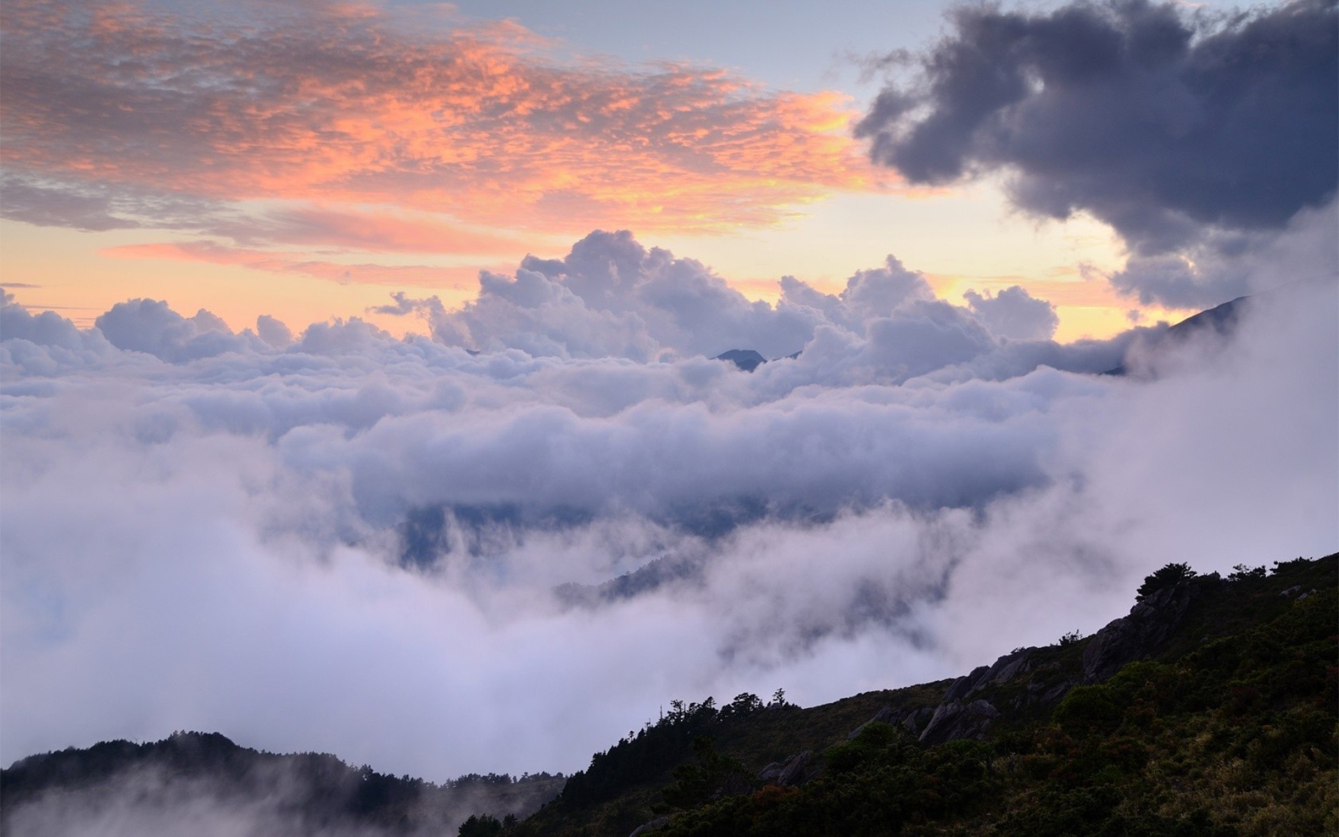 Sunset over mountain clouds