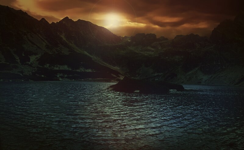 sunset over mountain lake