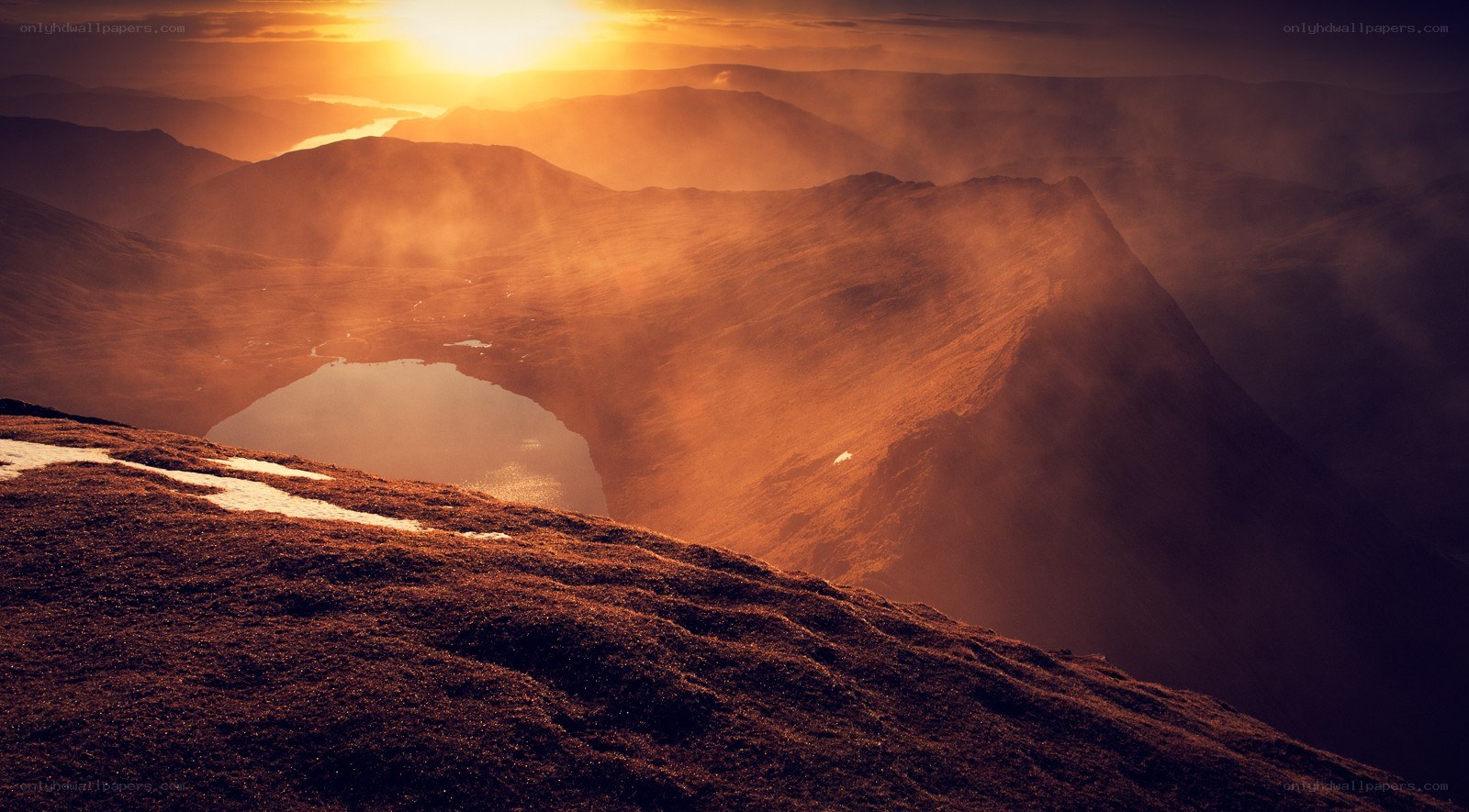 Sunset over mountain lake