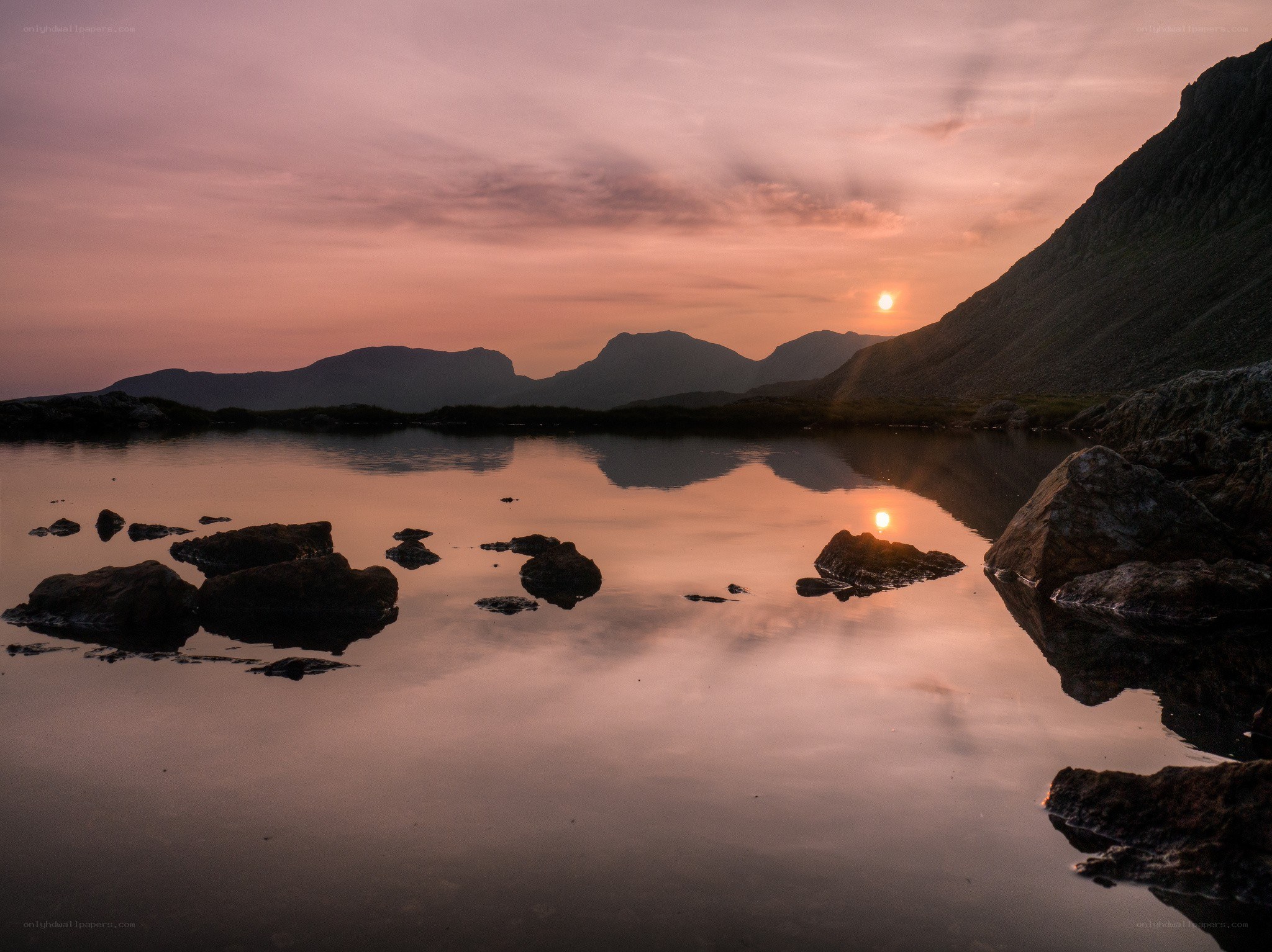 Sunset over mountain lake