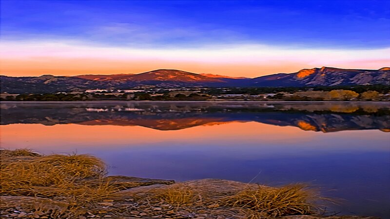 sunset over mountain lake