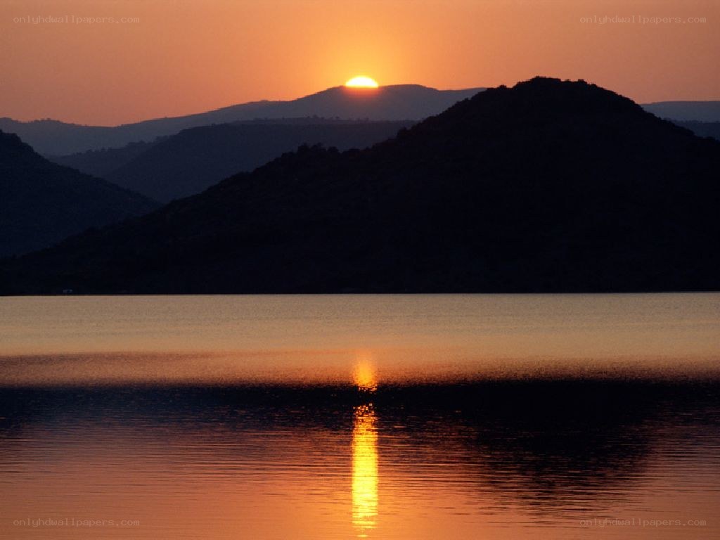 Sunset over mountain lake