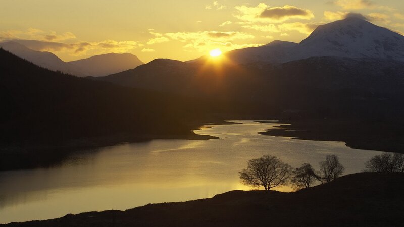 sunset over mountain lake