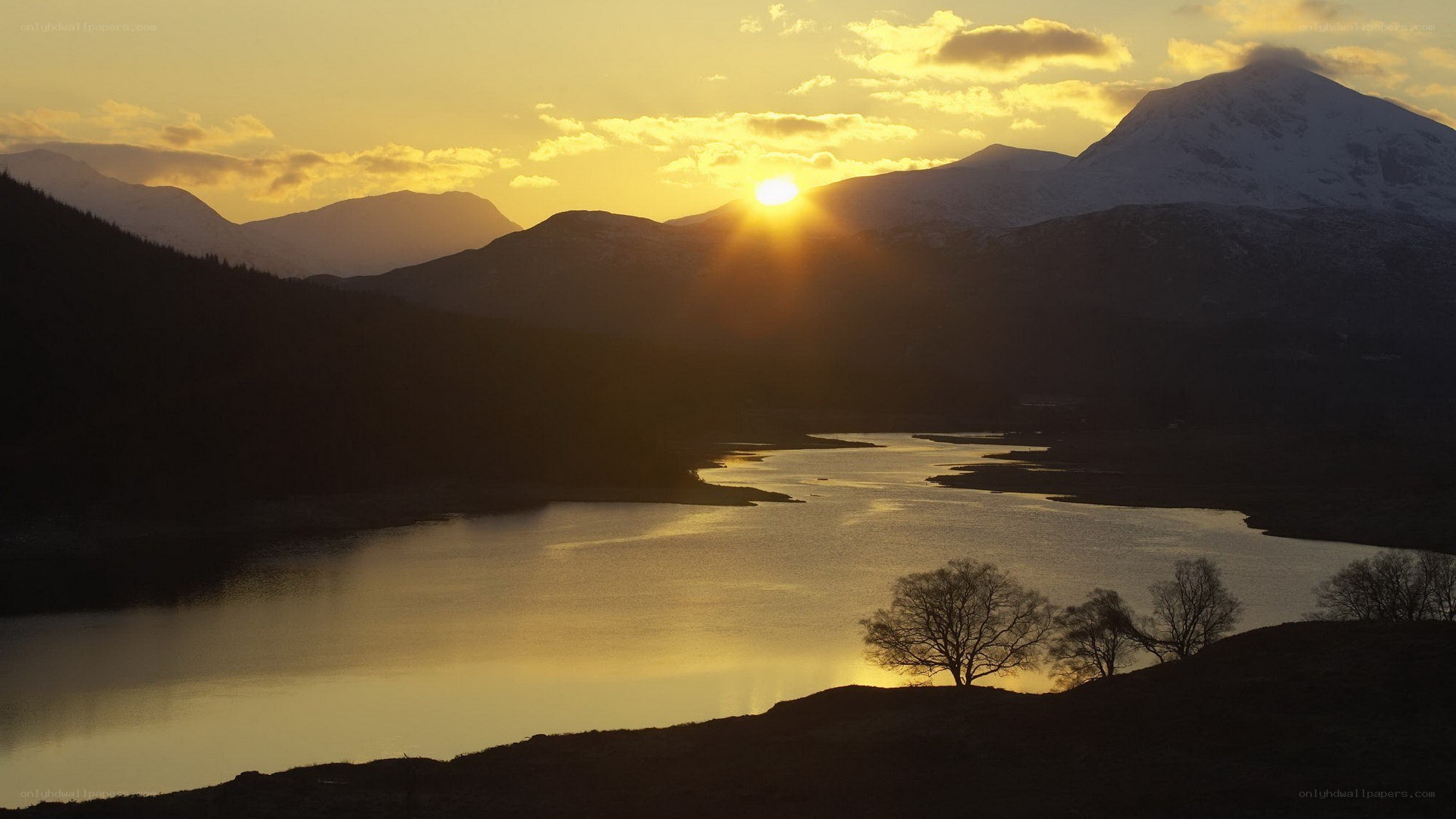 sunset over mountain lake