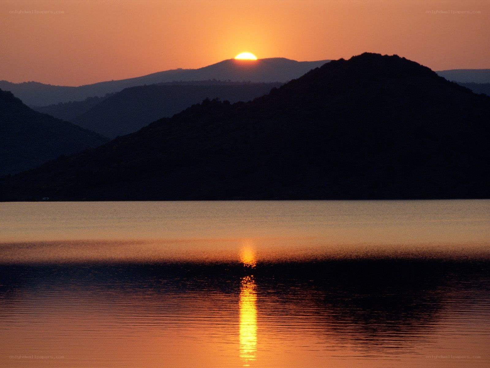 Sunset over mountain lake