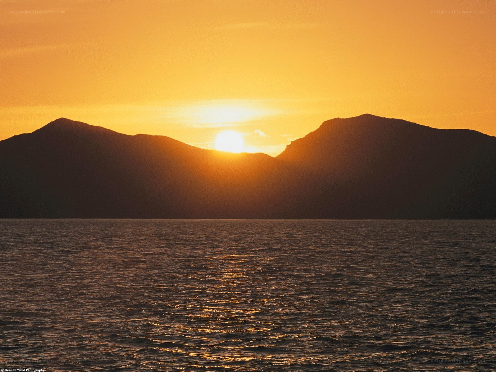Sunset over mountain silhouette