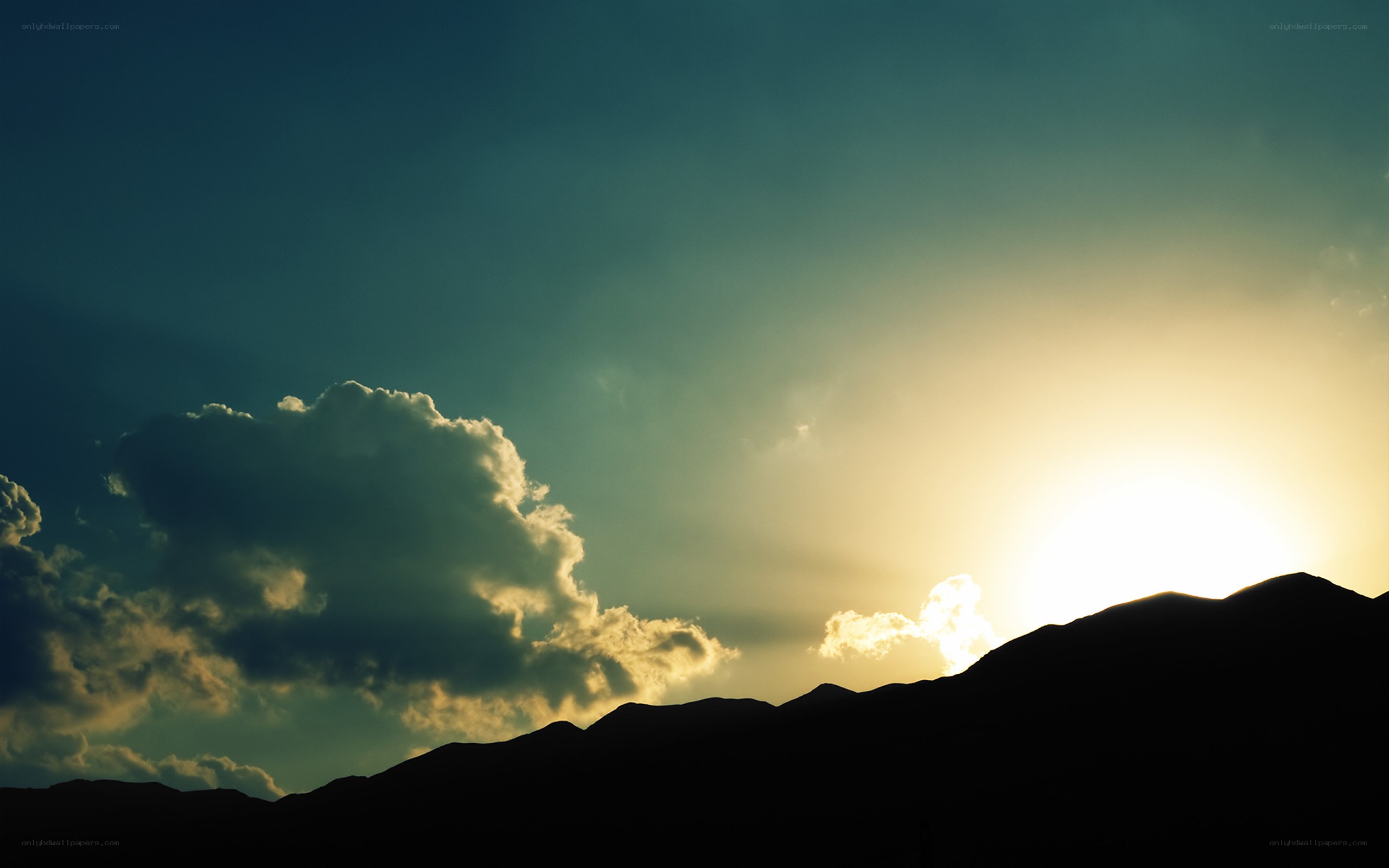 Sunset over mountain silhouette