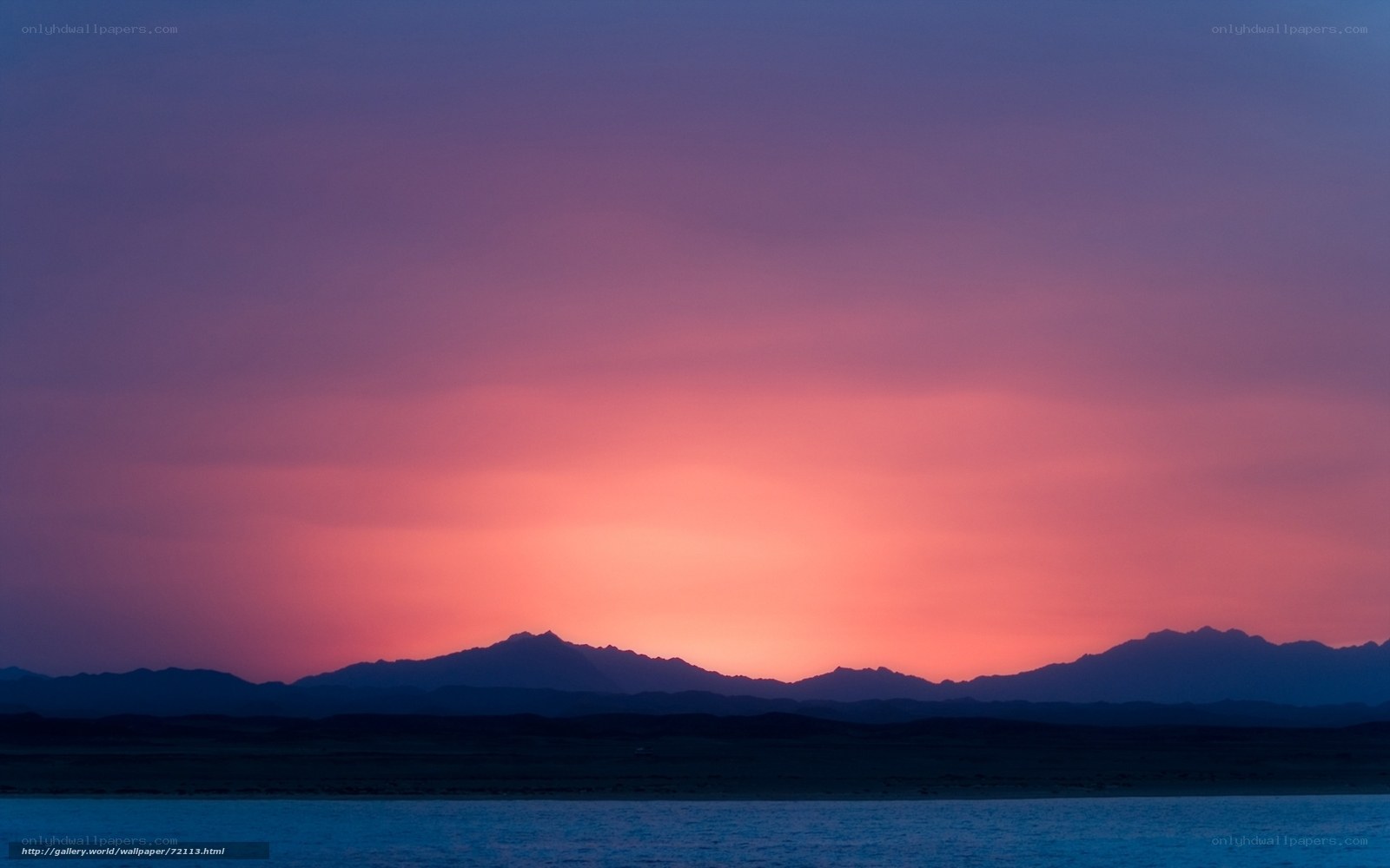 Sunset over mountain silhouette