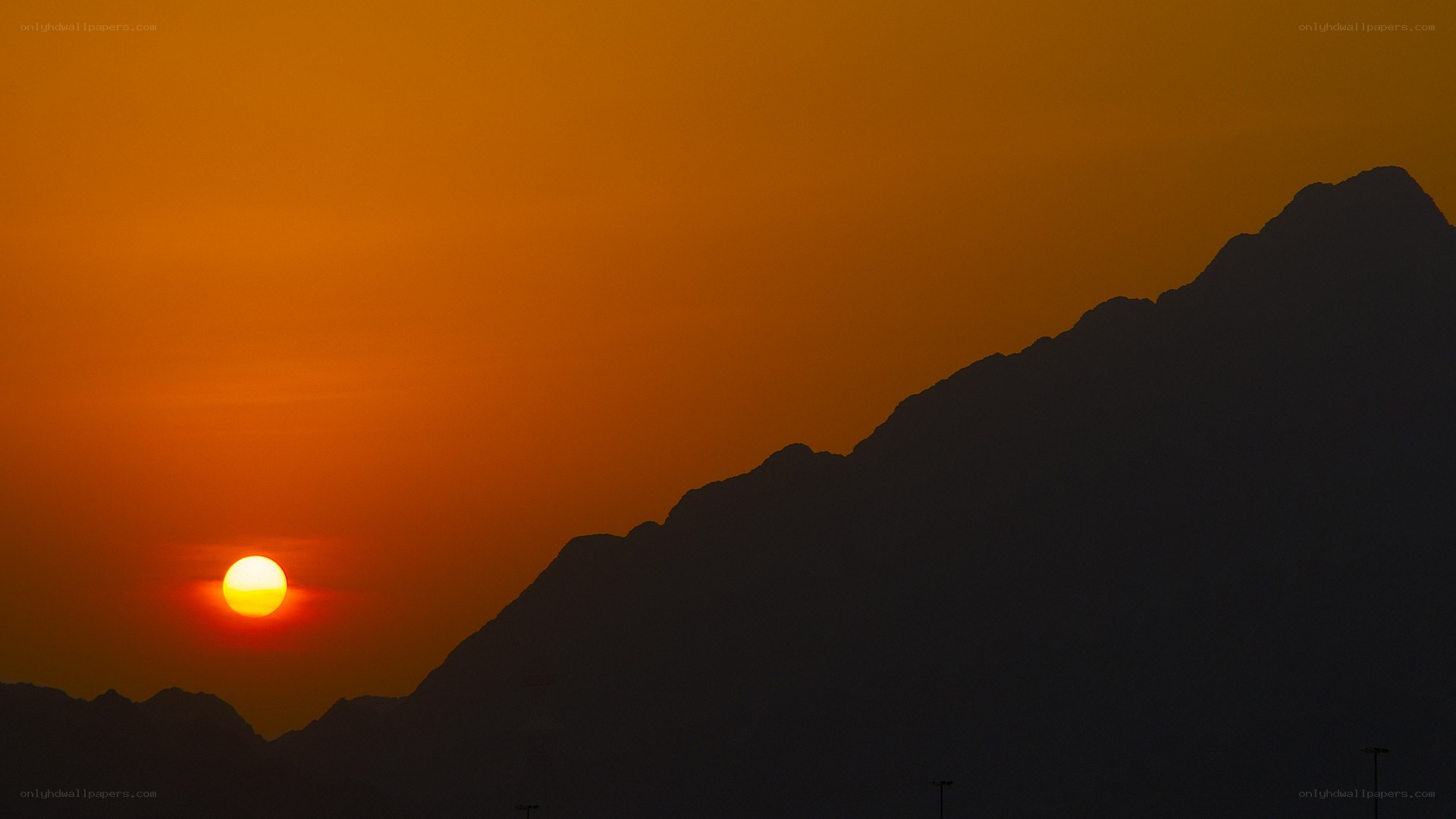 Sunset over mountain silhouette