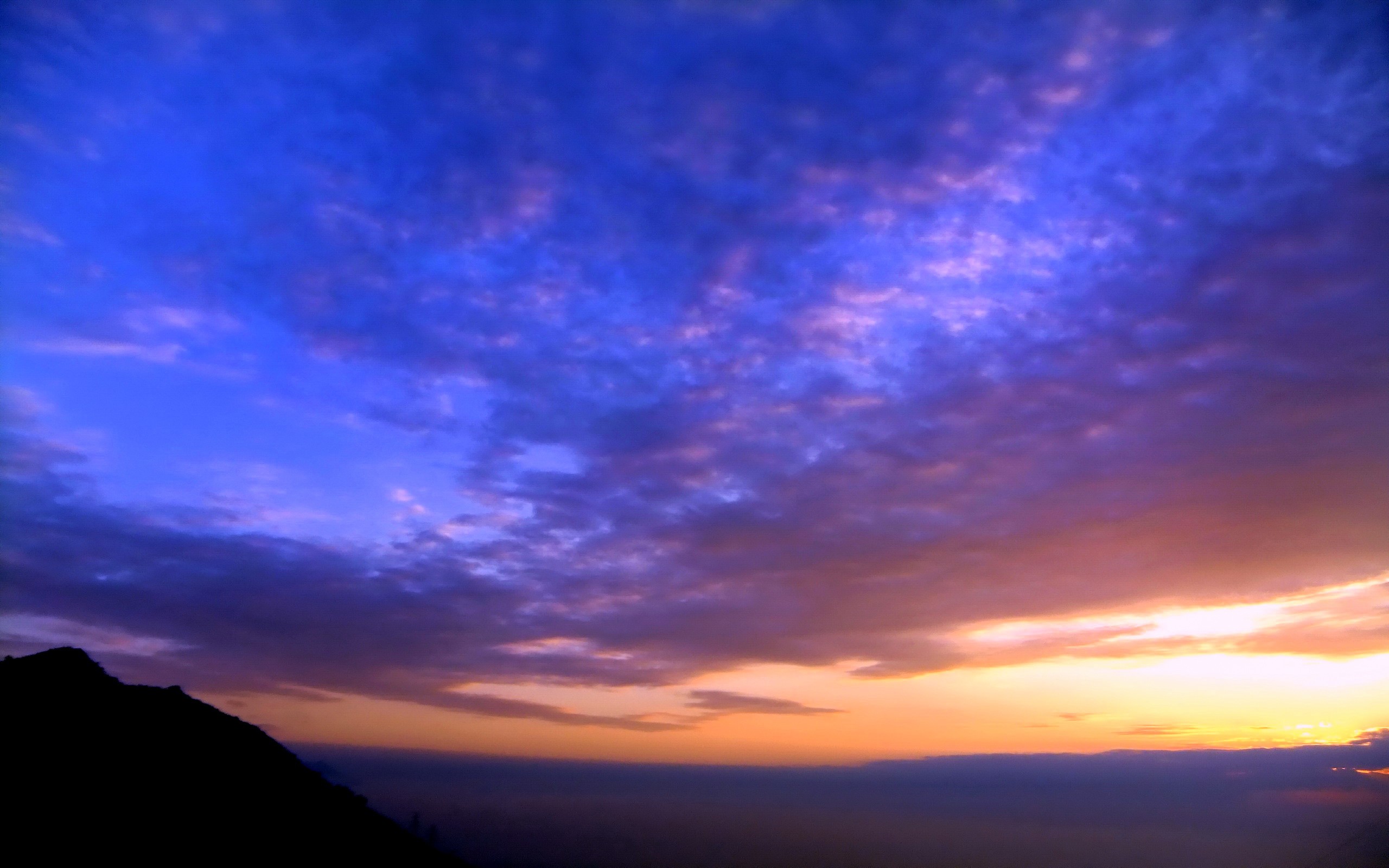 sunset over mountain silhouette