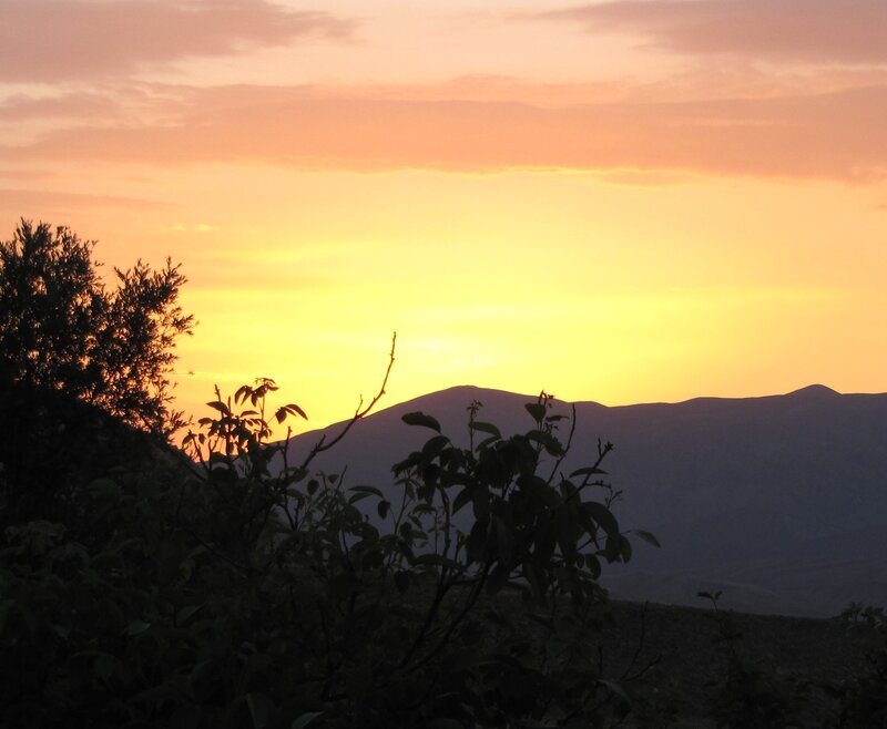 Sunset over mountain silhouette