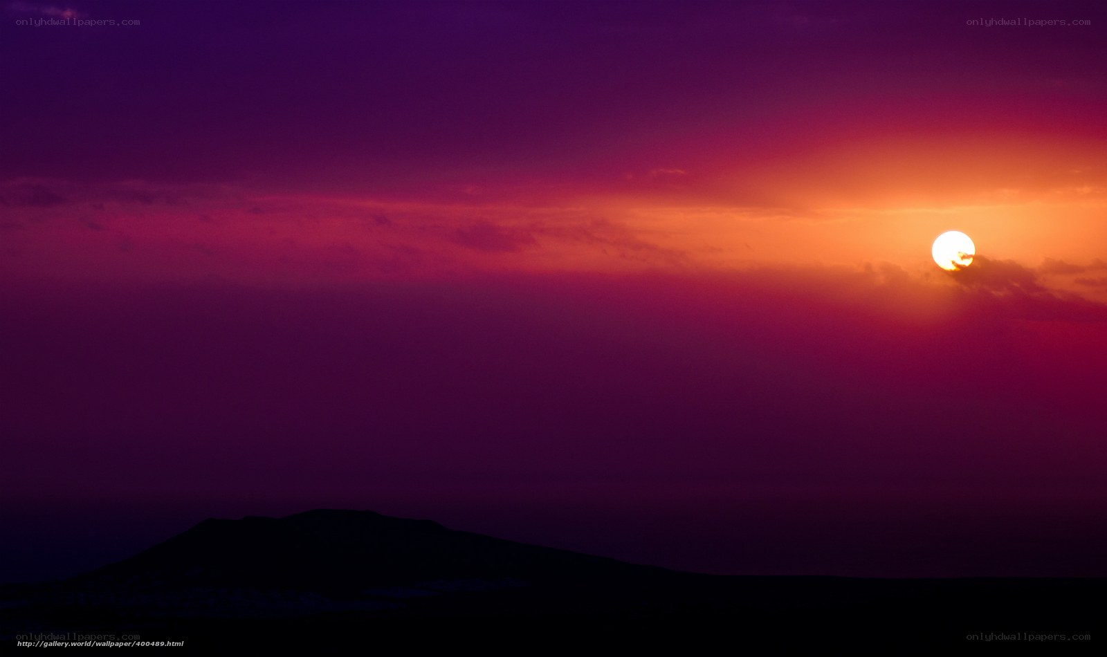Sunset over mountain silhouette