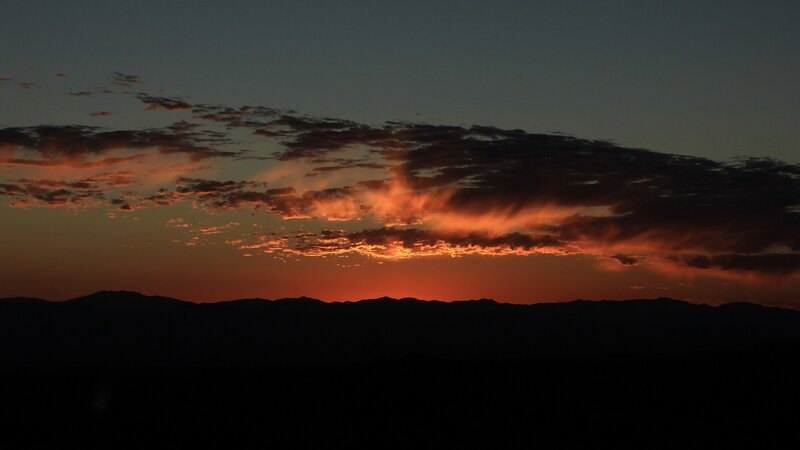 sunset over mountain silhouettes