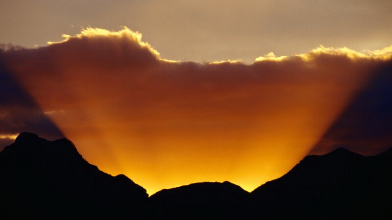 Sunset over mountain silhouettes
