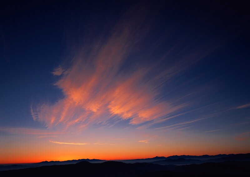 Sunset over mountain silhouettes