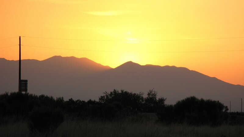 Sunset over mountain silhouettes
