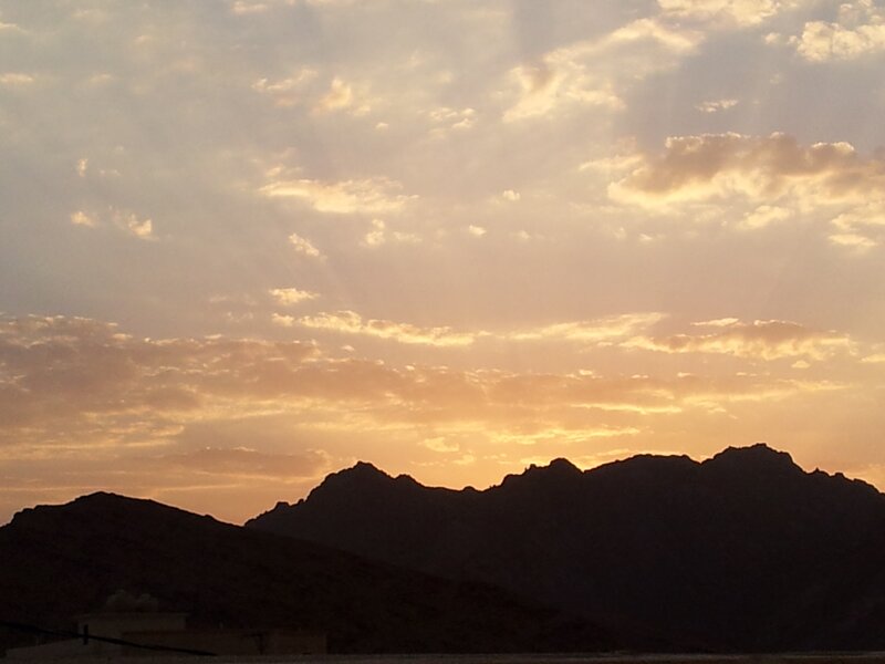 sunset over mountain silhouettes