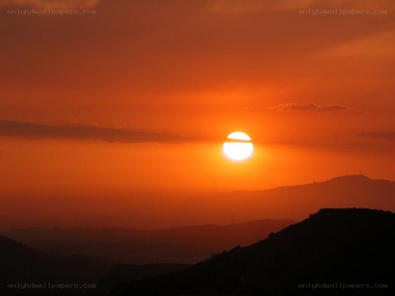 Sunset over mountain silhouettes