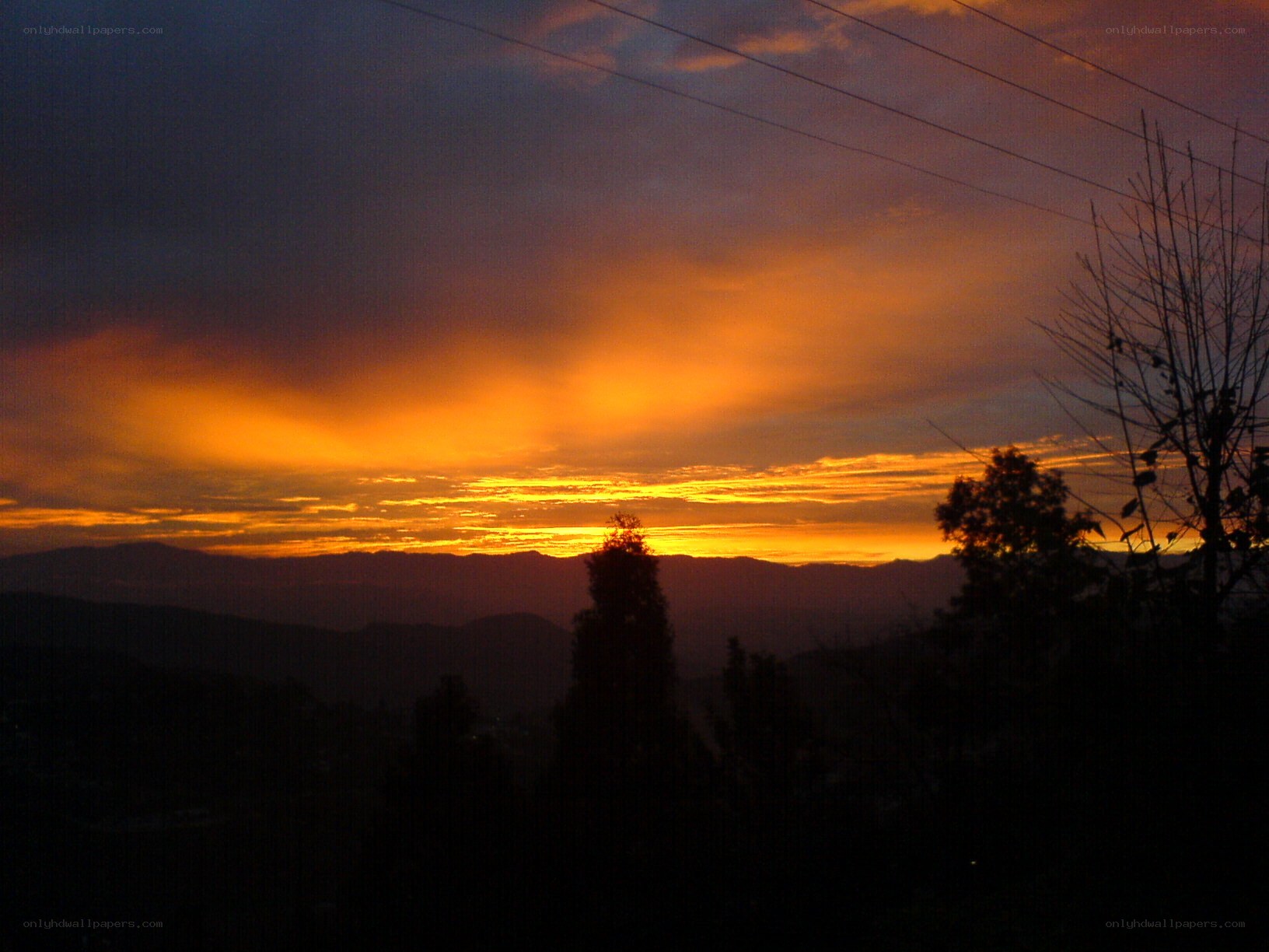 Sunset over mountain silhouettes