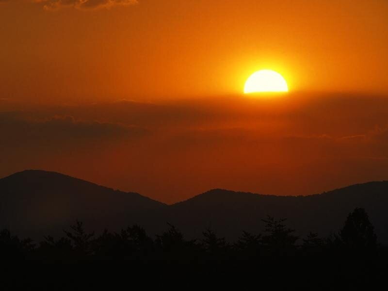 Sunset over mountain silhouettes