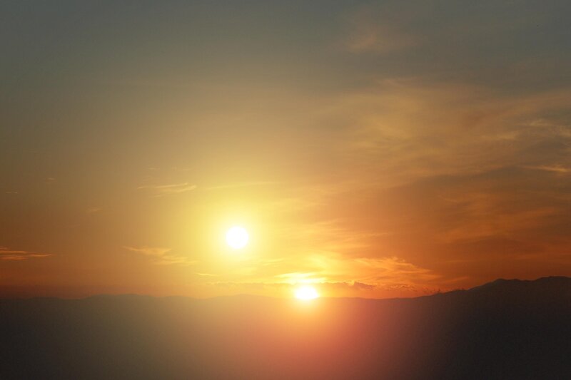 Sunset over mountain silhouettes