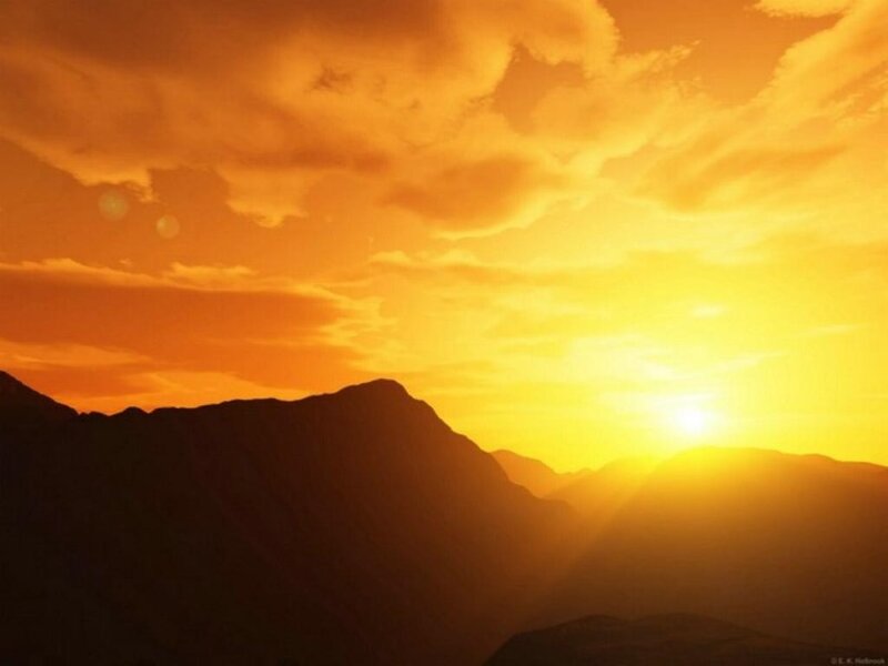 Sunset over mountain silhouettes