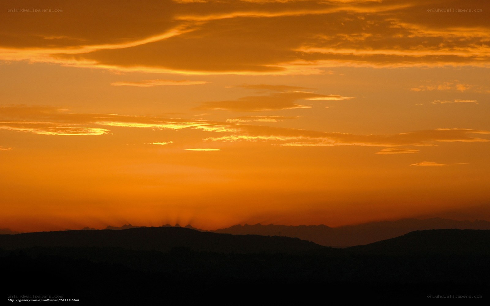 Sunset over mountain silhouettes