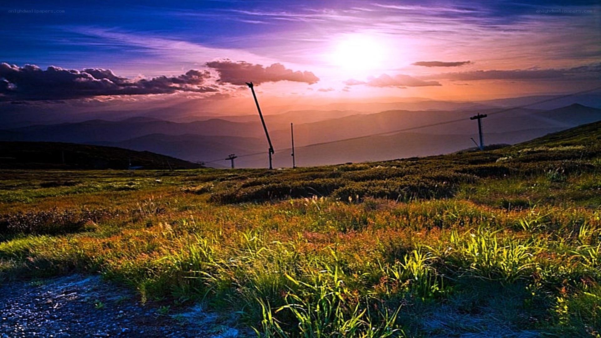 Sunset over mountain ski lift