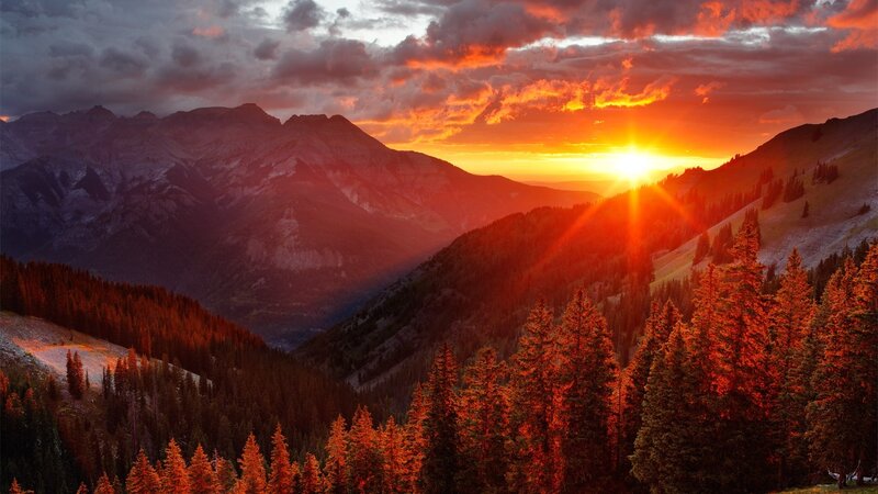 sunset over mountain valley
