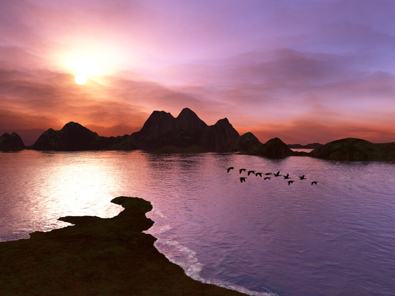 Sunset over mountainous bay