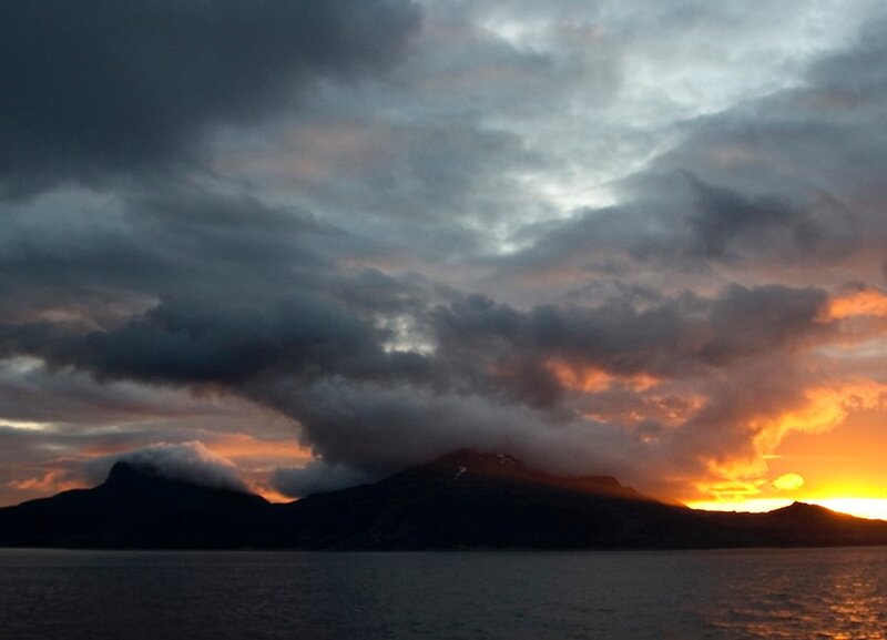 sunset over mountainous coast