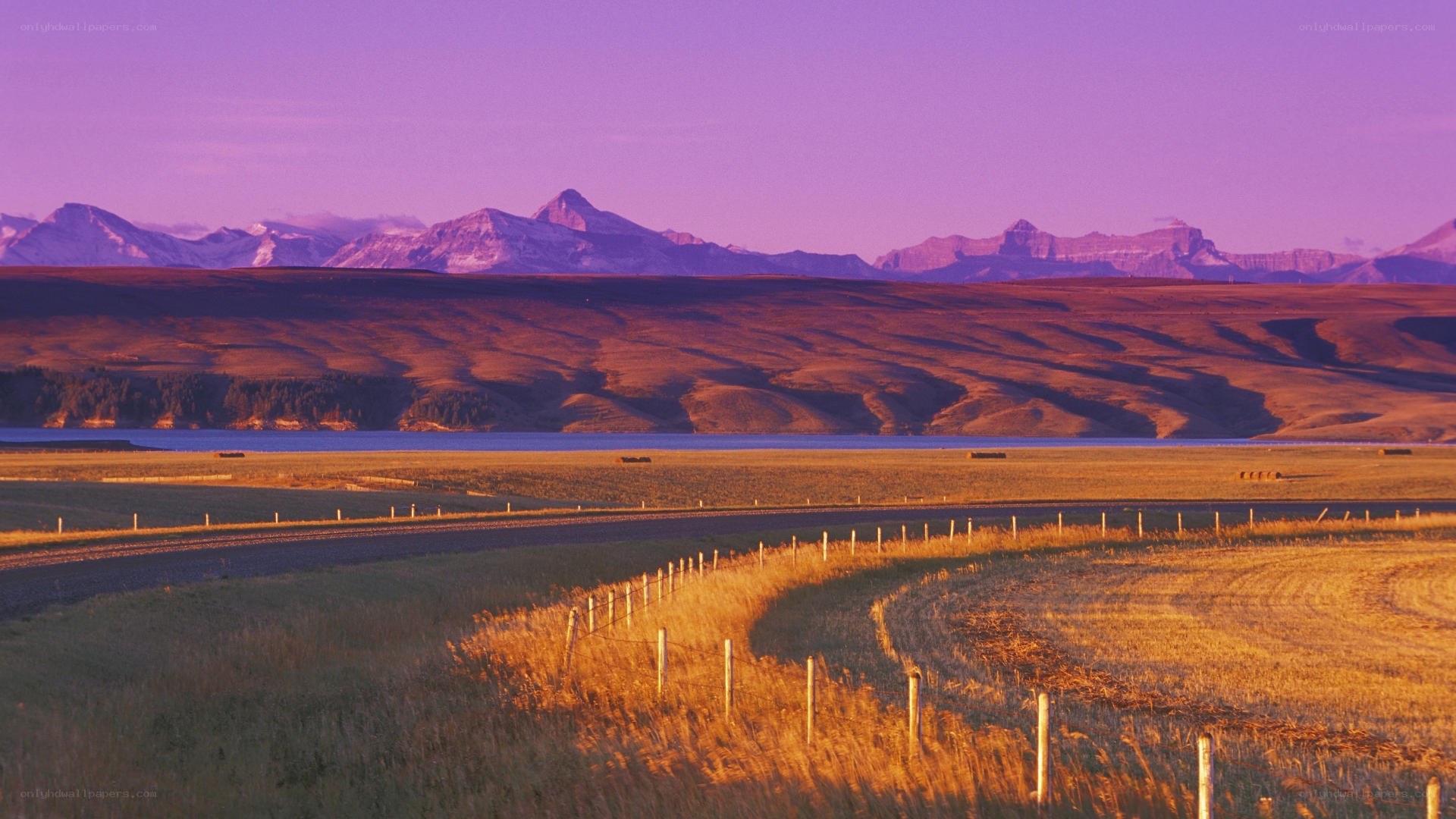Sunset over mountains and fields