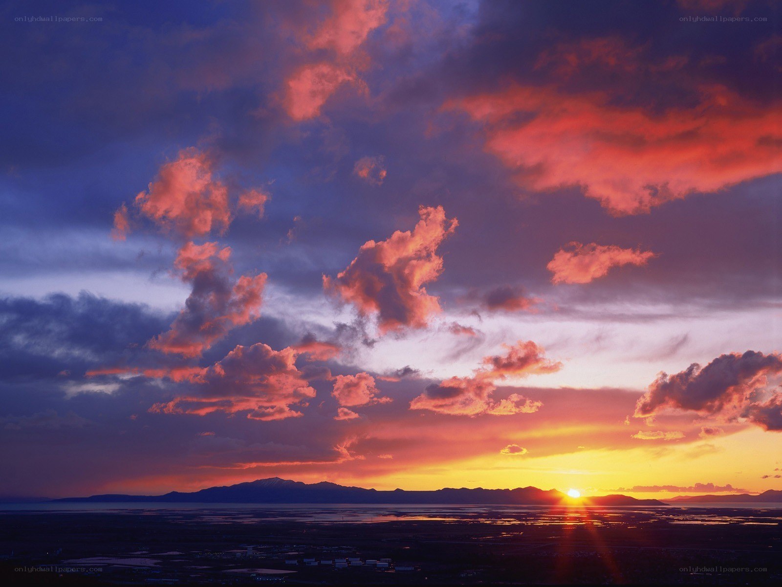 Sunset over mountains and lake