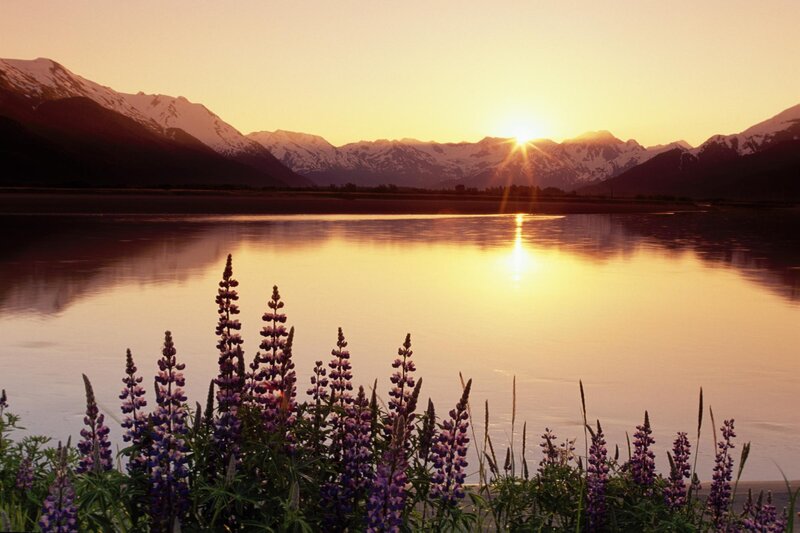 Sunset over mountains and lake
