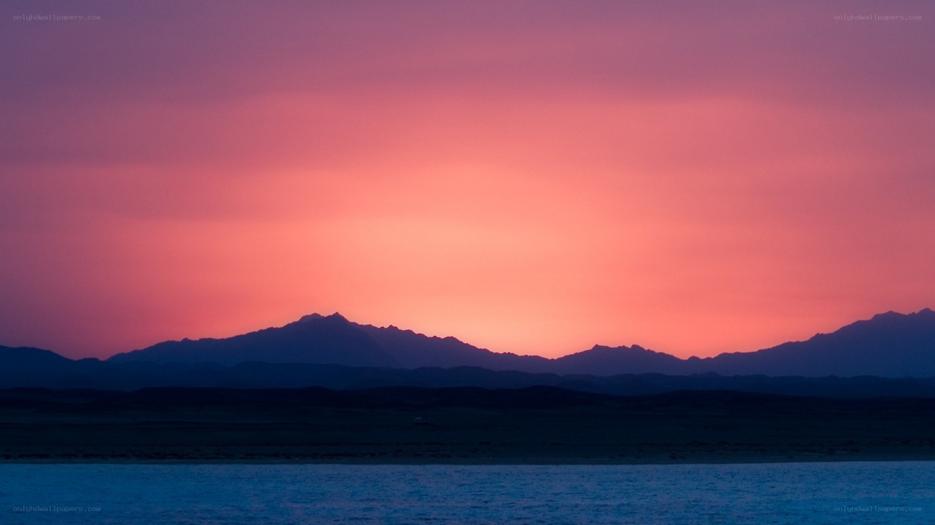 sunset over mountains and lake