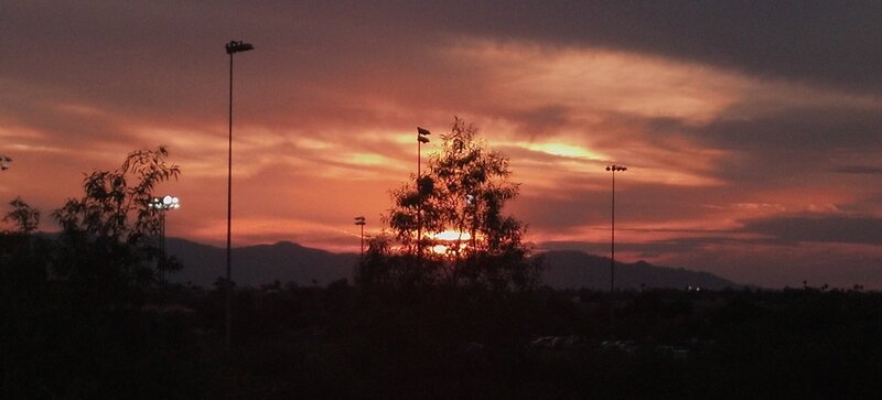 sunset over mountains and lights