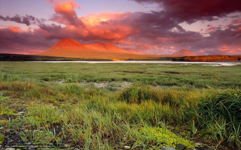 Sunset over mountains and marsh