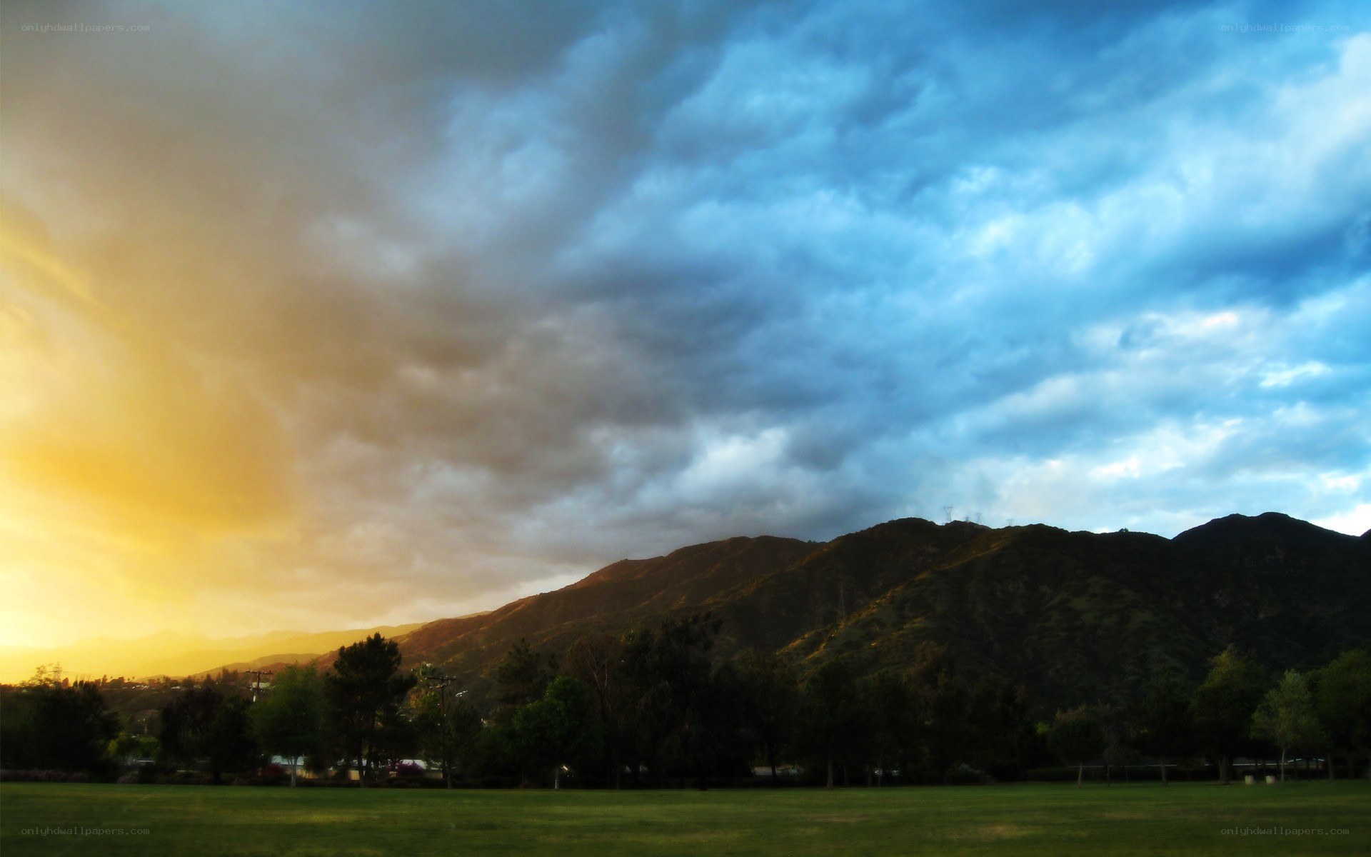 Sunset over mountains and park