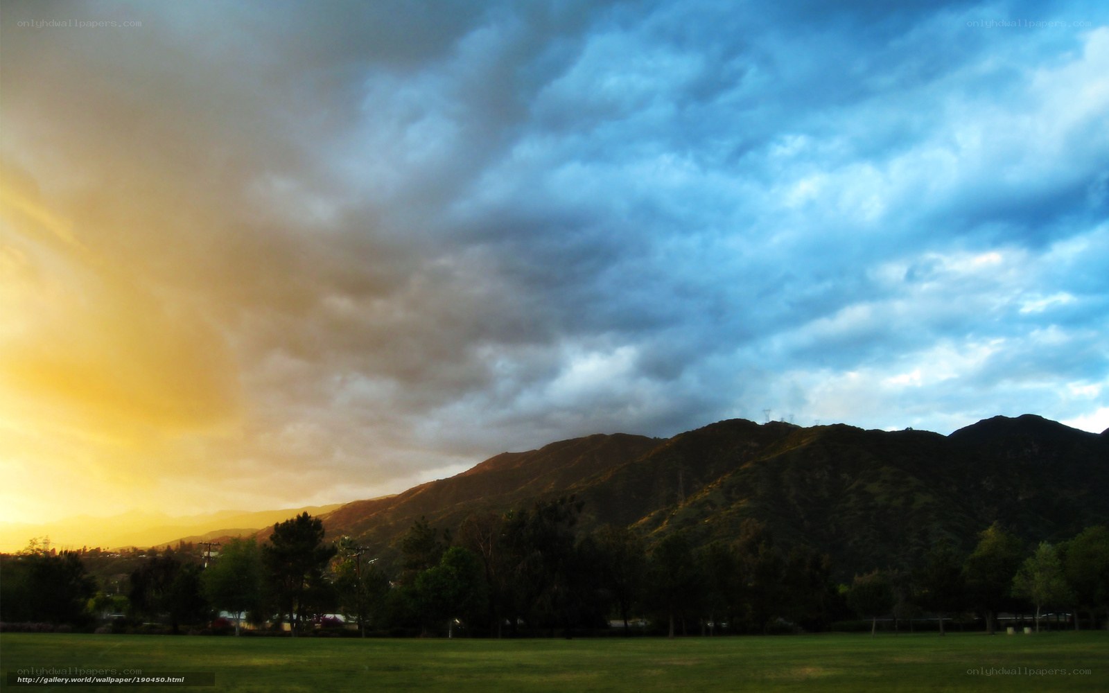 Sunset over mountains and park
