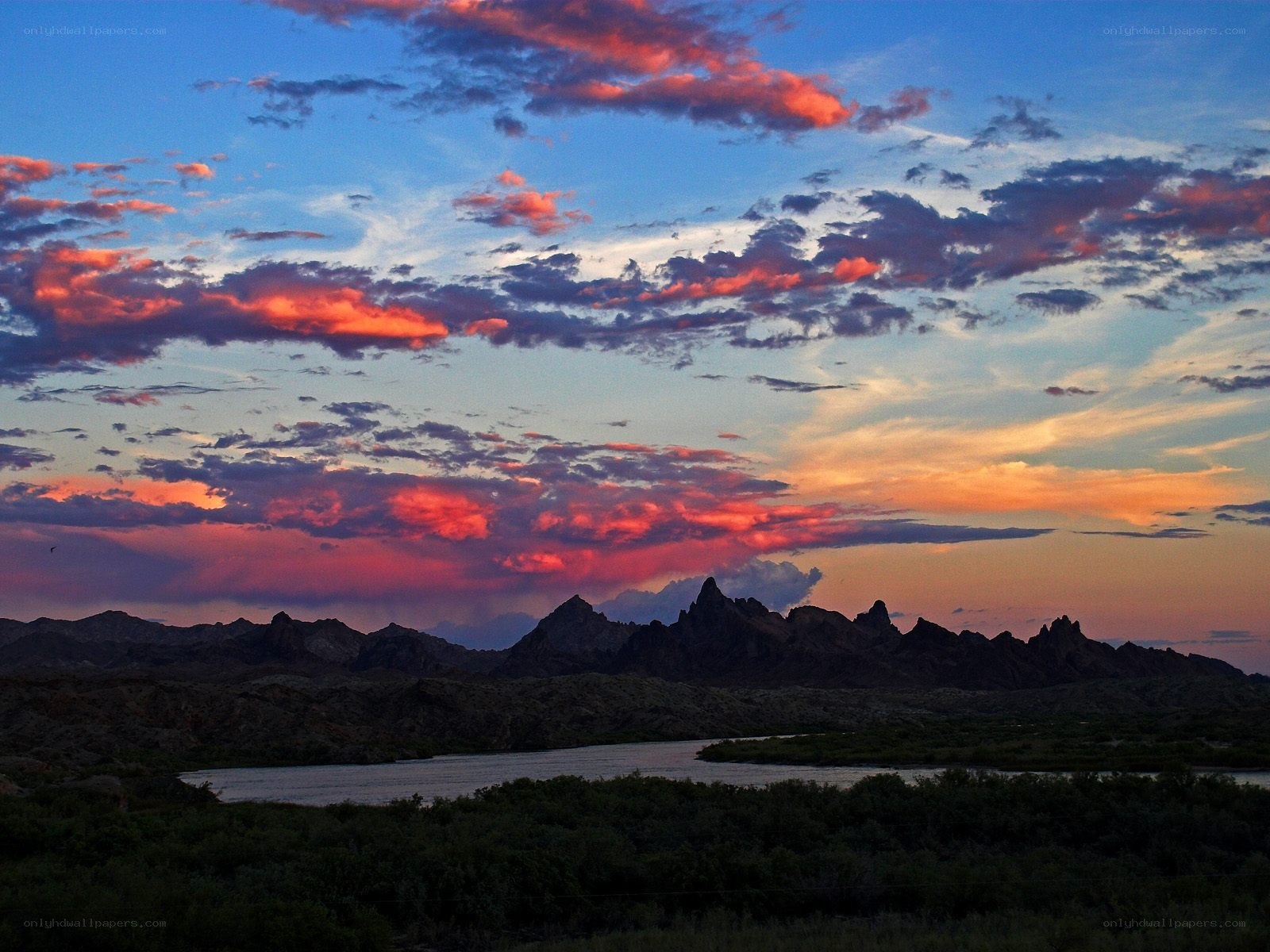 Sunset over mountains and river