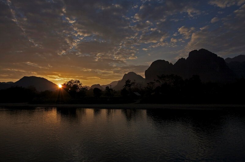 Sunset over mountains and river
