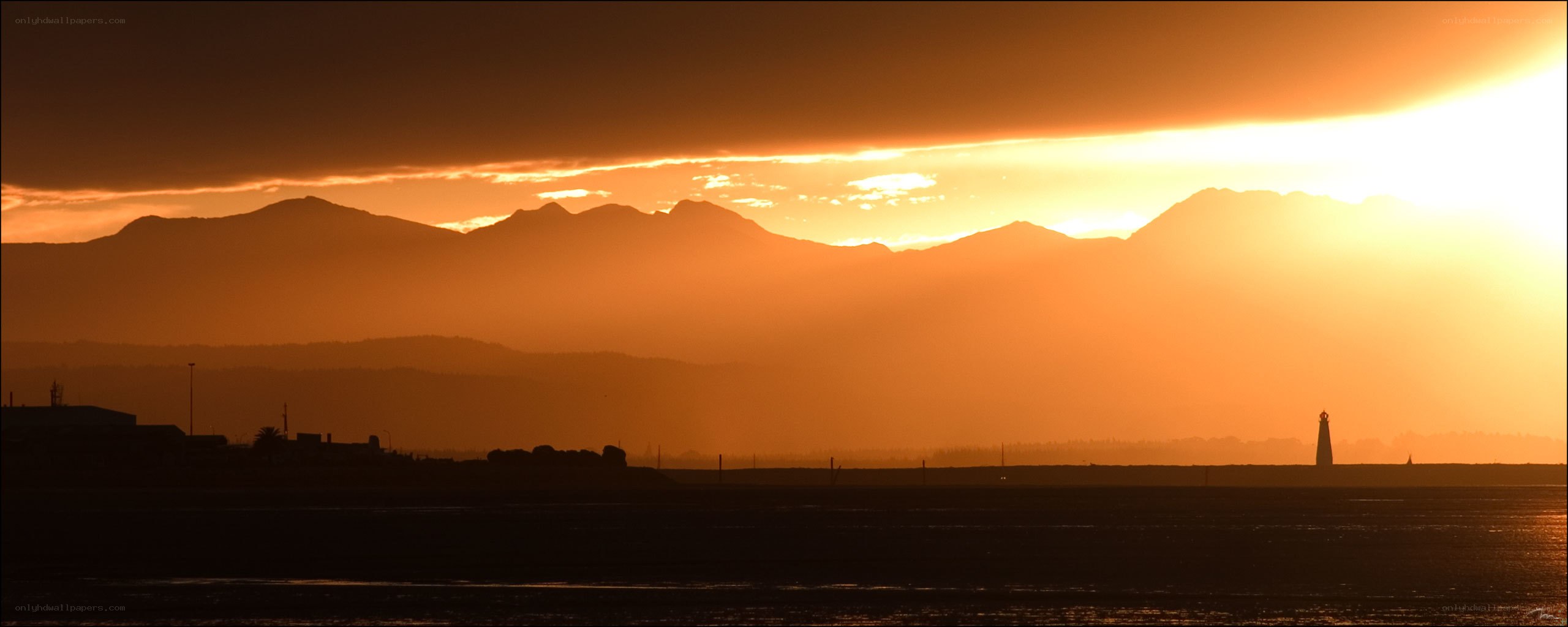 sunset over mountains and sea