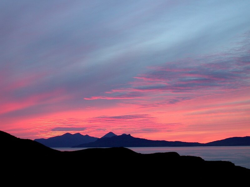 sunset over mountains and sea