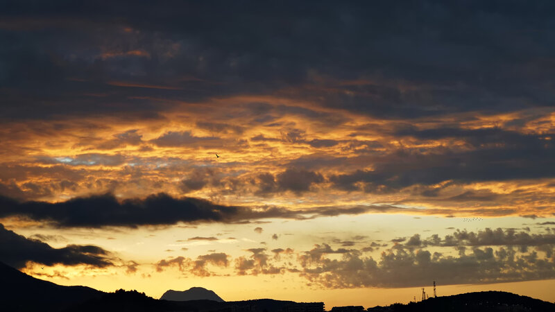 Sunset over Mountains — Orange, Dramatic, Photograph, Clouds, Birds, Silhouette
