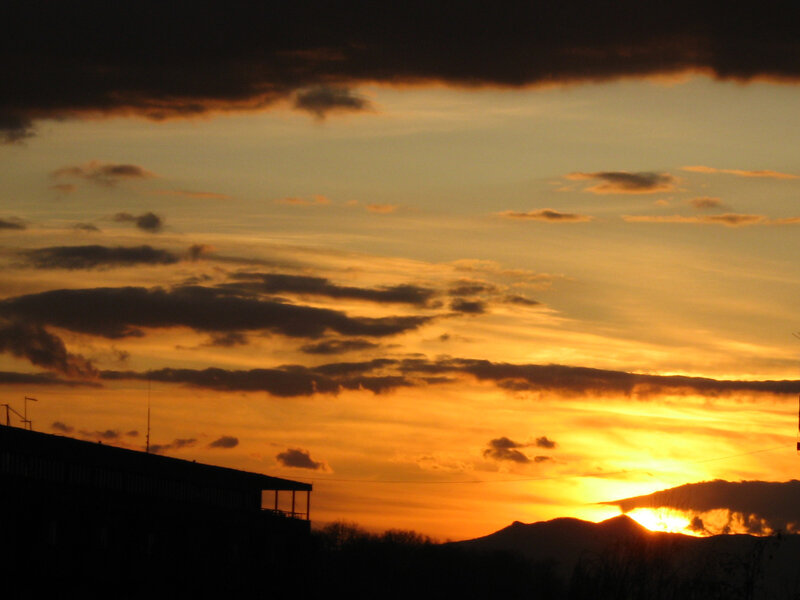 Sunset over Mountains — Orange, Dramatic, Photograph, Clouds, Building