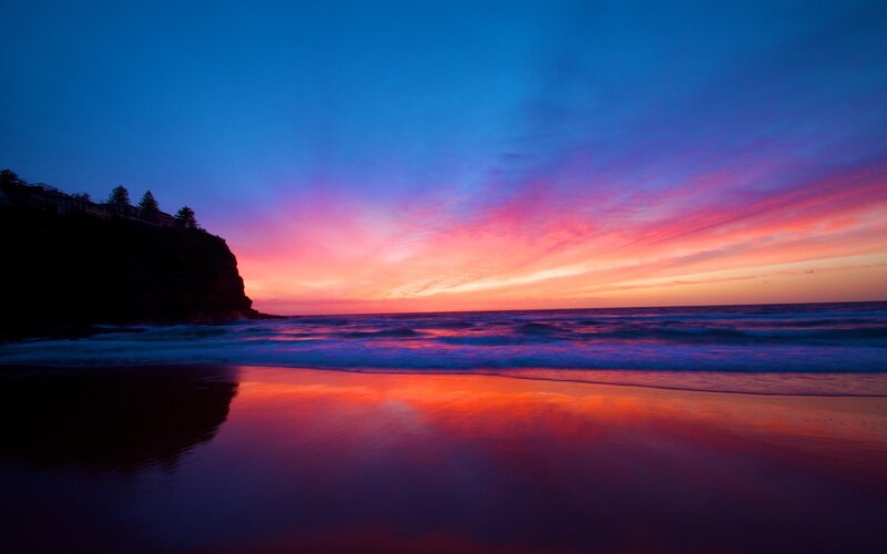 Sunset over Ocean Beach — Blue, Dramatic, Photograph, Cliff, Trees