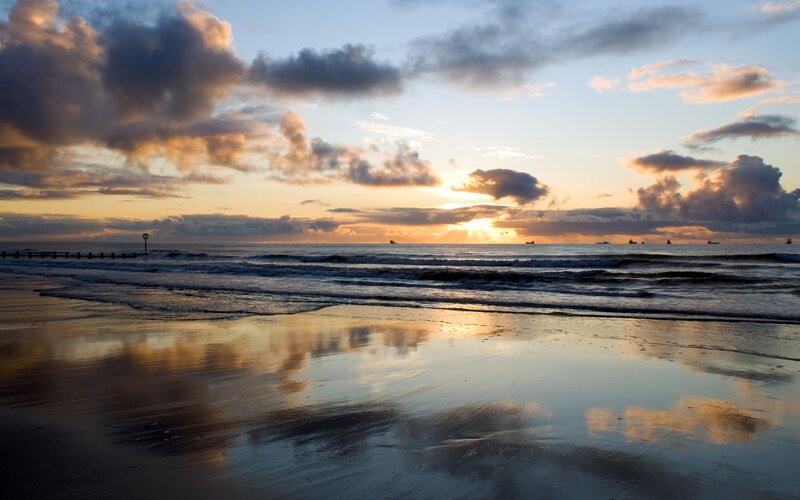 Sunset over Ocean Beach — Blue, Serene, Photograph, Clouds