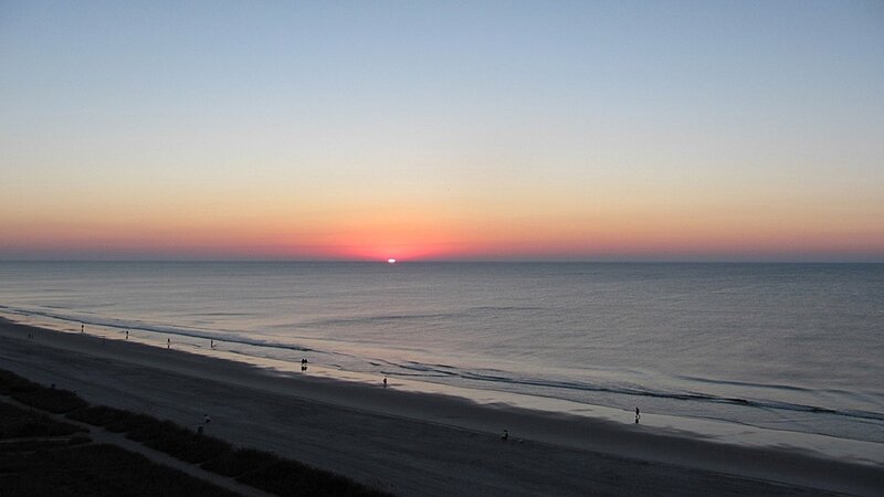 Sunset over Ocean Beach — Blue, Serene, Photograph, People