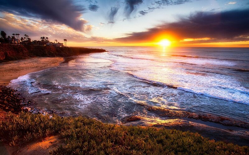 Sunset over Ocean Beach — Orange, Dramatic, Photograph, Cliff, Palm Trees