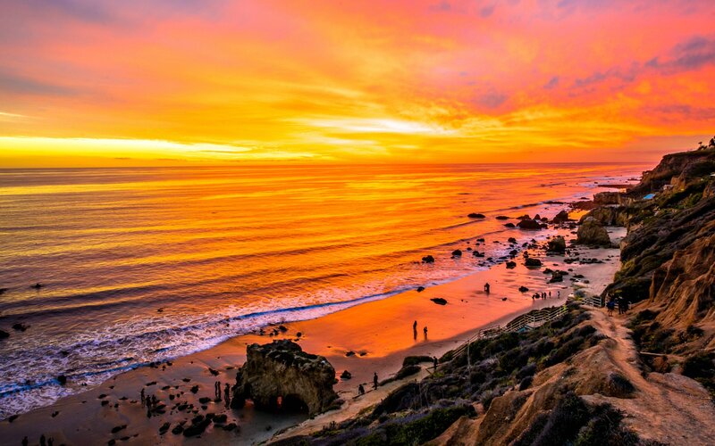 Sunset over Ocean Beach — Orange, Dramatic, Photograph, Cliffs
